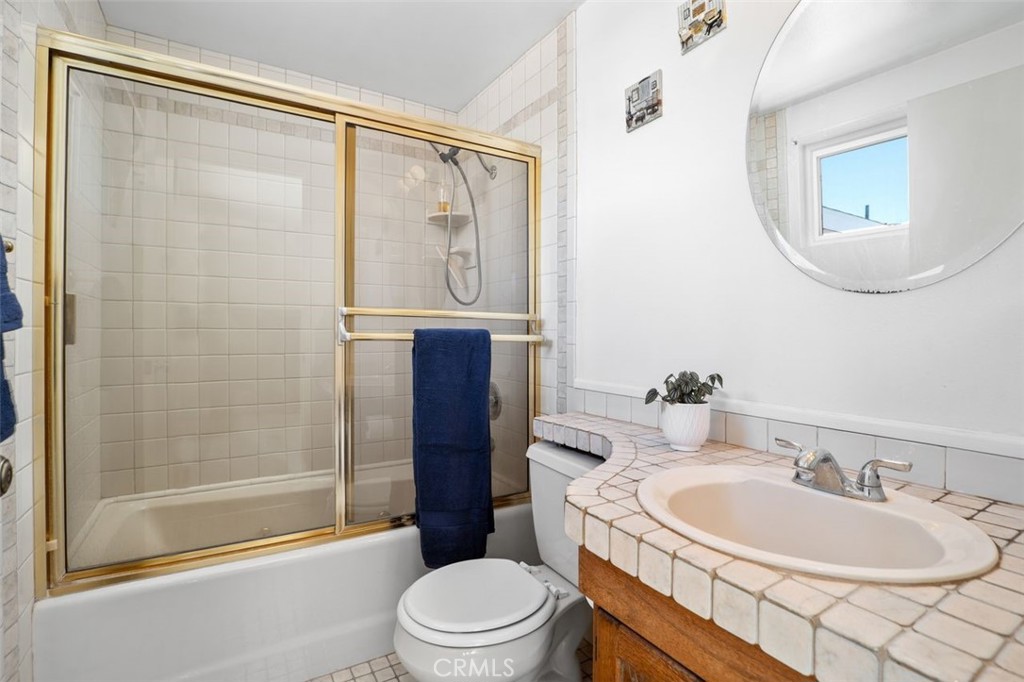 2233 East Everett Place Orange, CA 92867 - Photo 26 of 40 a bathroom with a sink a toilet and shower