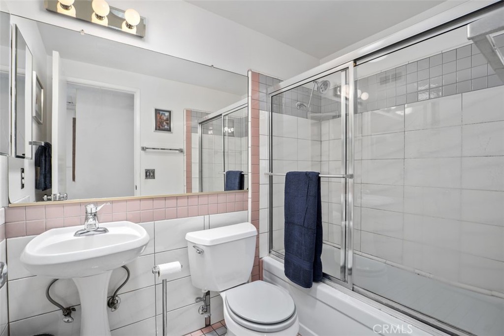 2233 East Everett Place Orange, CA 92867 - Photo 28 of 40 a bathroom with a sink toilet and shower