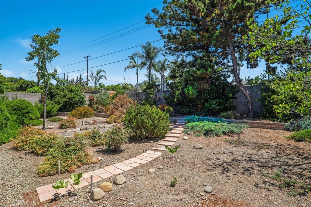 2233 East Everett Place Orange, CA 92867 - Photo 34 of 40 a view of a garden with plants and large trees