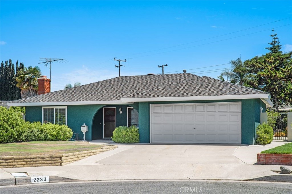 2233 East Everett Place Orange, CA 92867 - Photo 38 of 40 a front view of a house with a yard