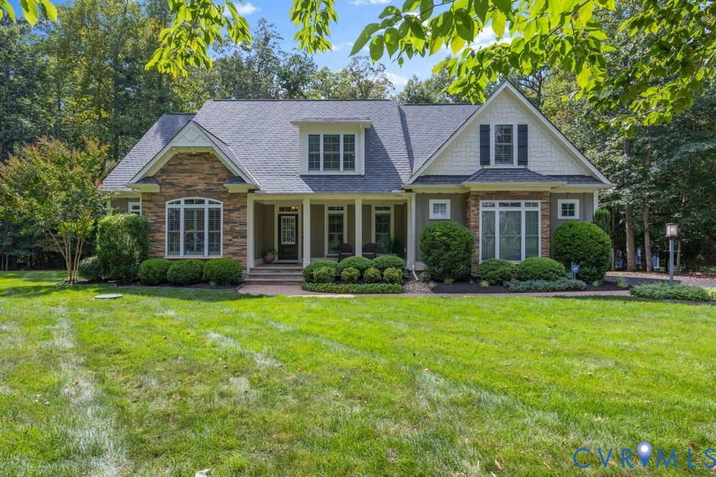 11518 Barrows Ridge Lane Chesterfield, VA 23838 - Photo 1 of 41 a front view of a house with a yard and trees