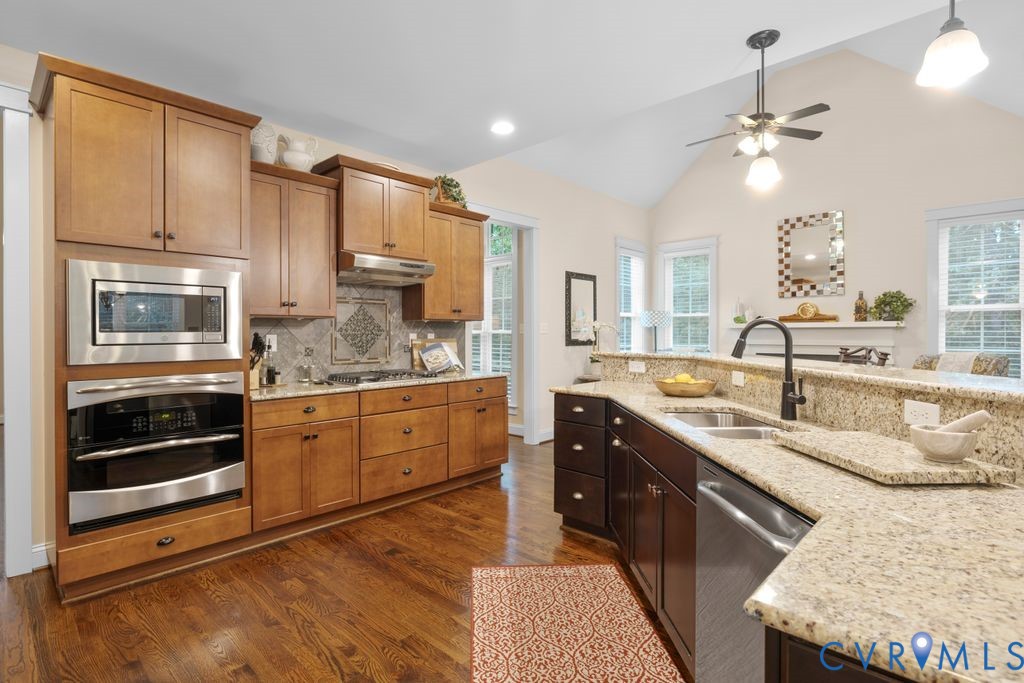 11518 Barrows Ridge Lane Chesterfield, VA 23838 - Photo 12 of 41 a large kitchen with stainless steel appliances granite countertop a sink stove and refrigerator