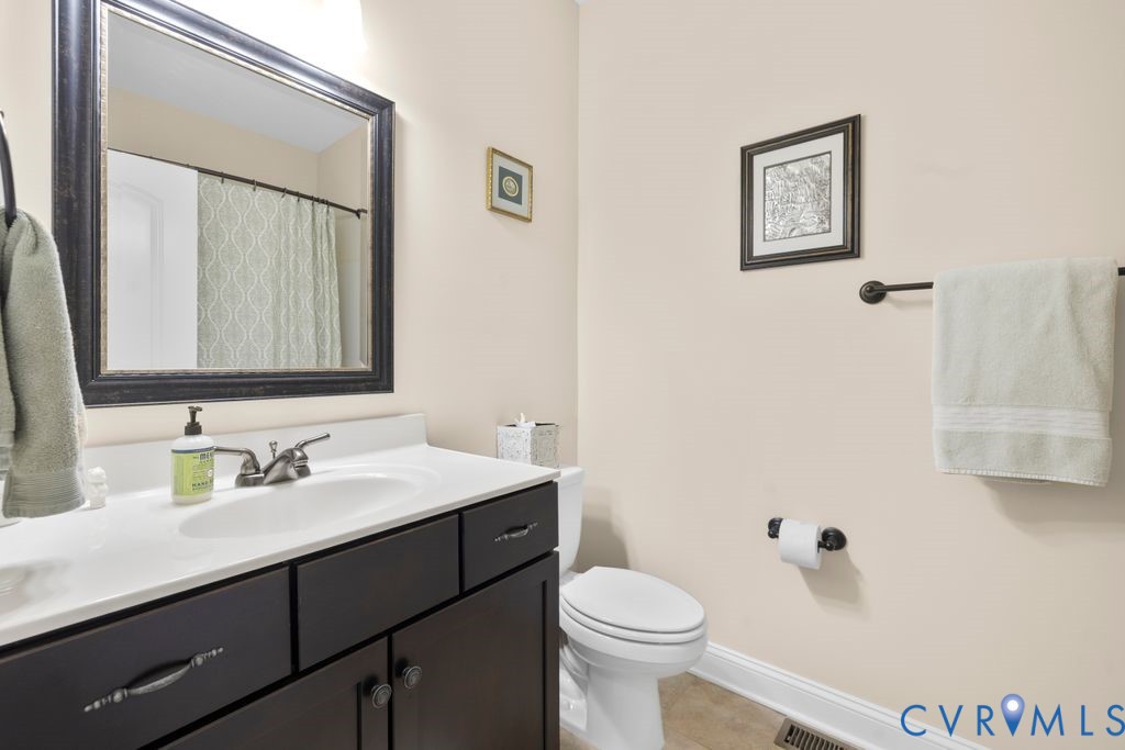 11518 Barrows Ridge Lane Chesterfield, VA 23838 - Photo 24 of 41 a bathroom with a sink a toilet and mirror