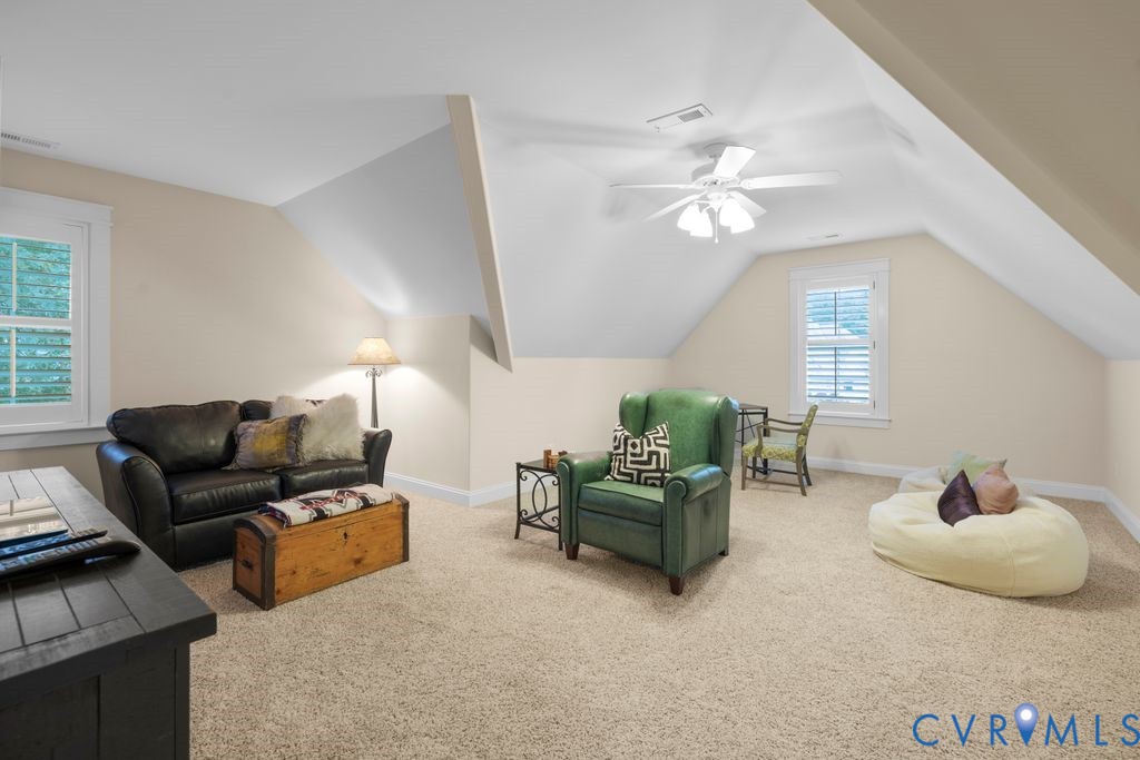 11518 Barrows Ridge Lane Chesterfield, VA 23838 - Photo 29 of 41 a living room with furniture ceiling fan and a window