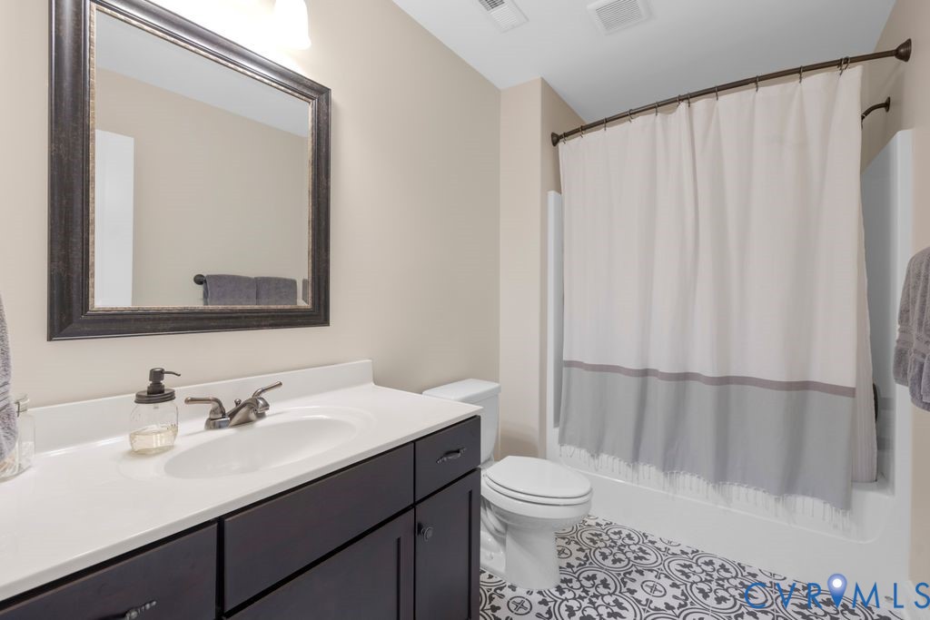 11518 Barrows Ridge Lane Chesterfield, VA 23838 - Photo 31 of 41 a bathroom with a sink a toilet and shower