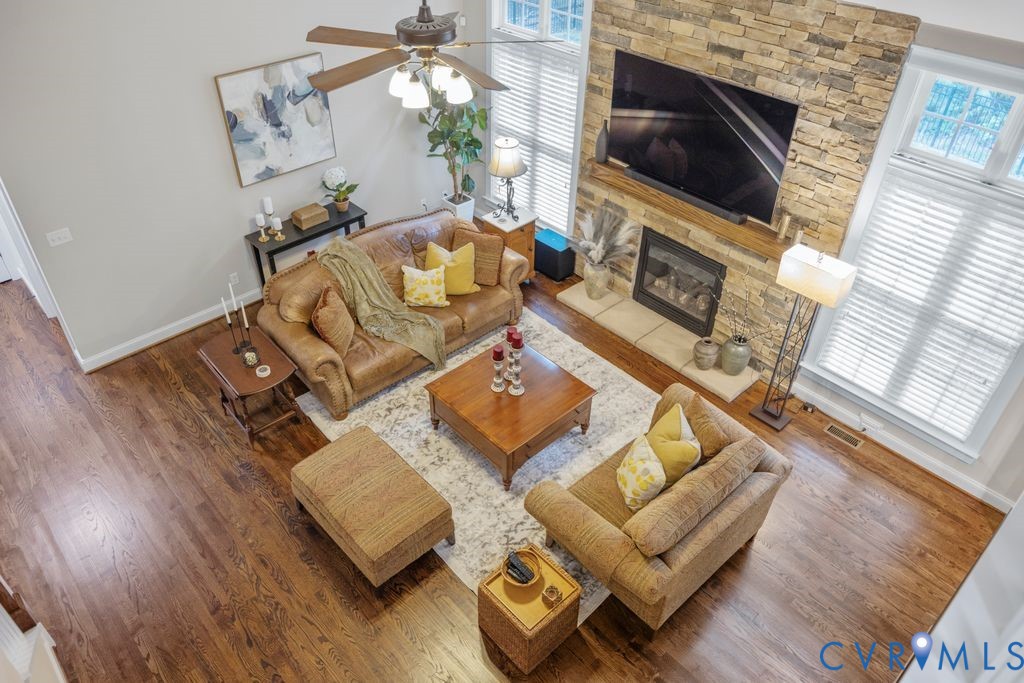 11518 Barrows Ridge Lane Chesterfield, VA 23838 - Photo 32 of 41 a living room with furniture and a fireplace