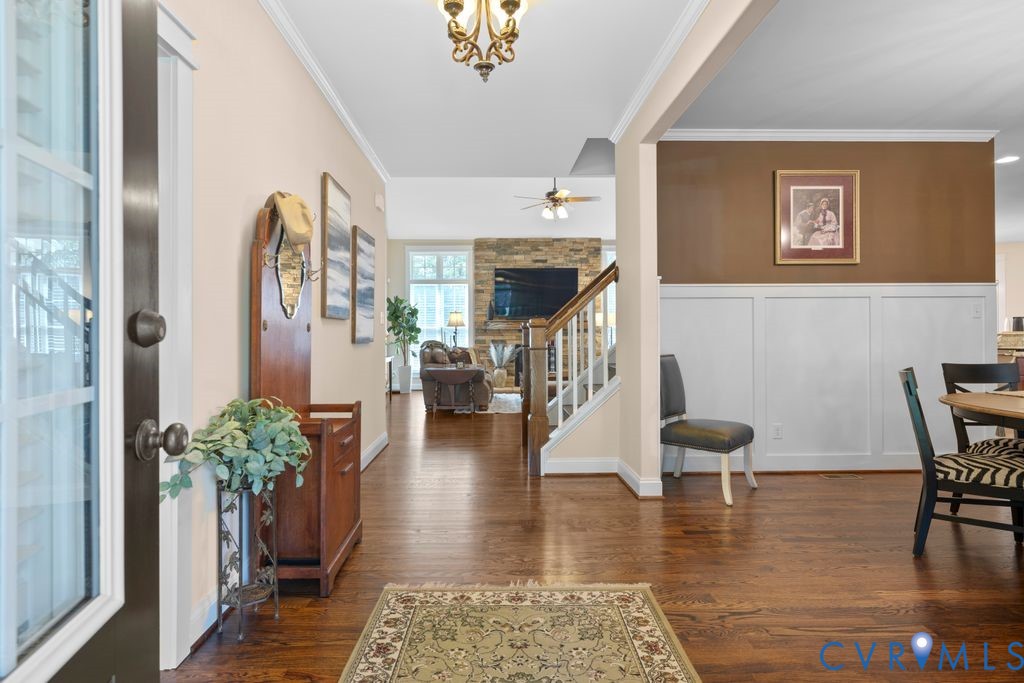 11518 Barrows Ridge Lane Chesterfield, VA 23838 - Photo 4 of 41 a view of a livingroom with furniture wooden floor and a table
