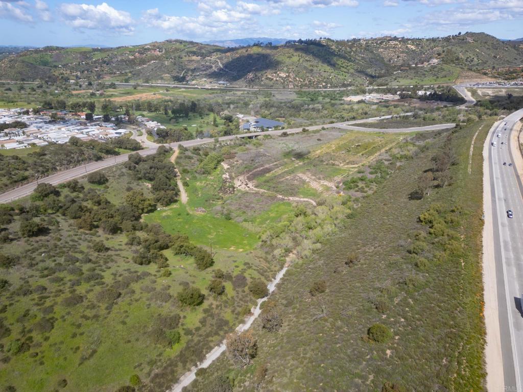 3309 San Rey Lane Bonsall, CA 92003 - Photo 7 of 16 a view of a lake with mountains in the background