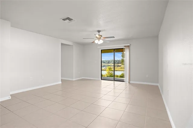 a view of a kitchen with a sink and a window