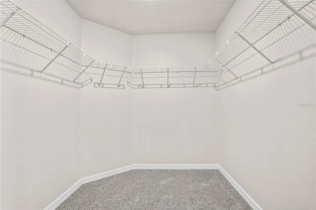 a bedroom with a bed and a closet