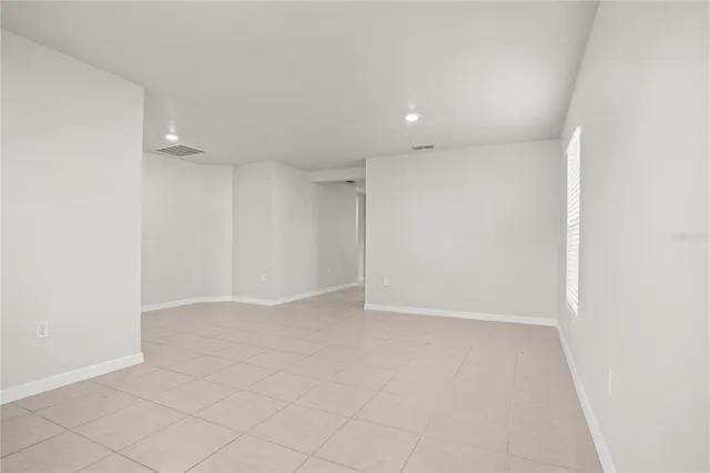 a kitchen with granite countertop a sink and a window