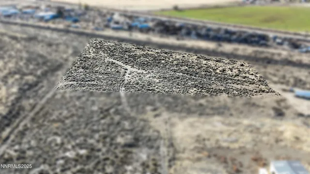 a view of a large mountain with mountains in the background