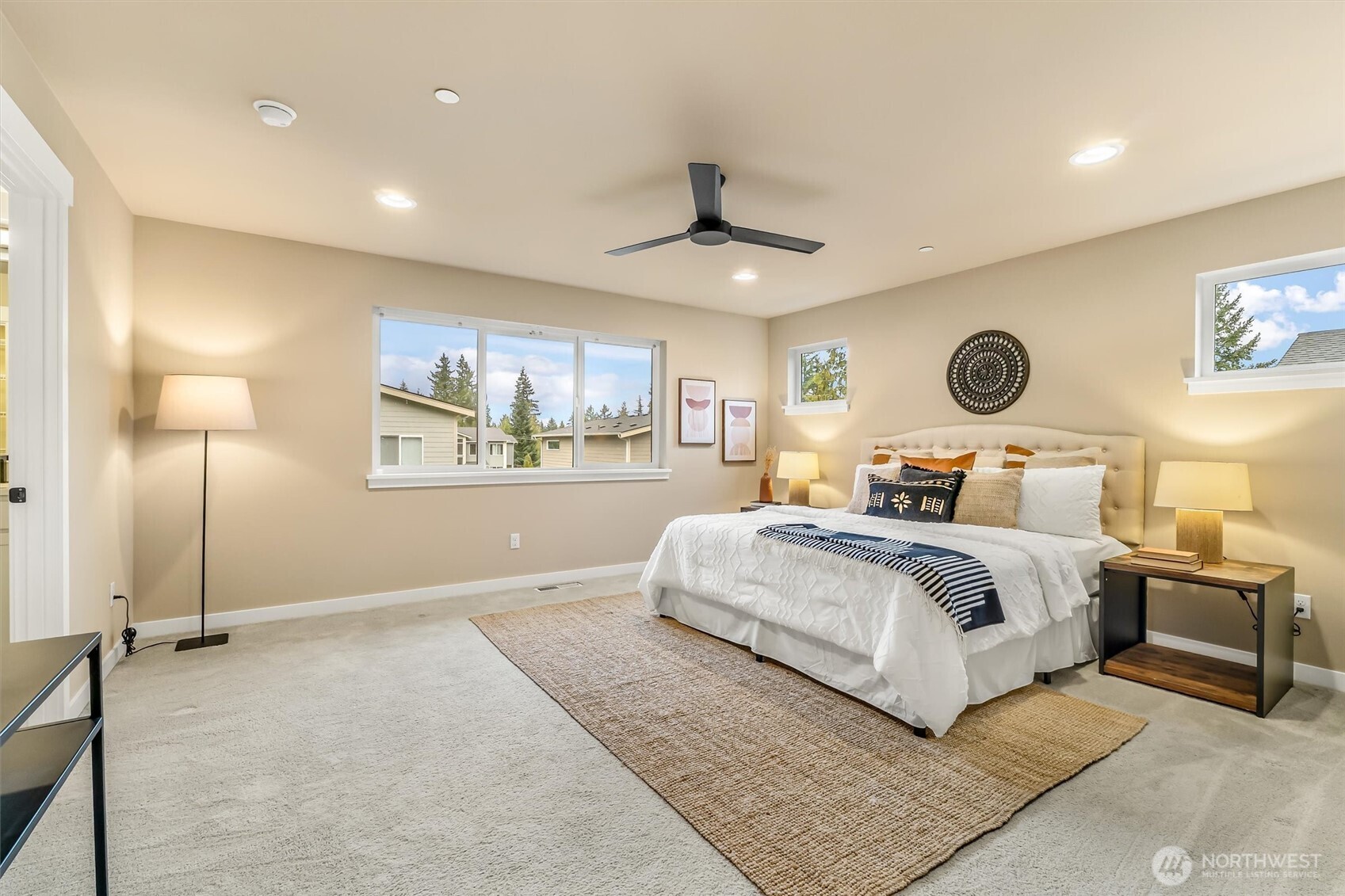 21707 2nd Avenue Southeast Bothell, WA 98021 - Photo 19 of 37 a bedroom with a large bed and a window