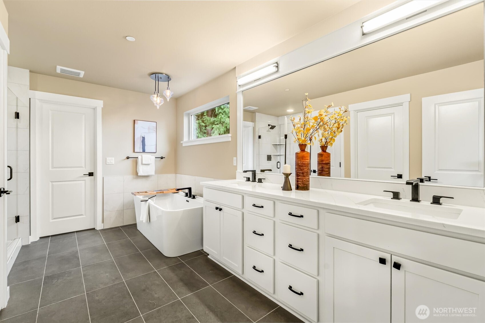 21707 2nd Avenue Southeast Bothell, WA 98021 - Photo 21 of 37 a spacious bathroom with a double vanity sink mirror and bathtub