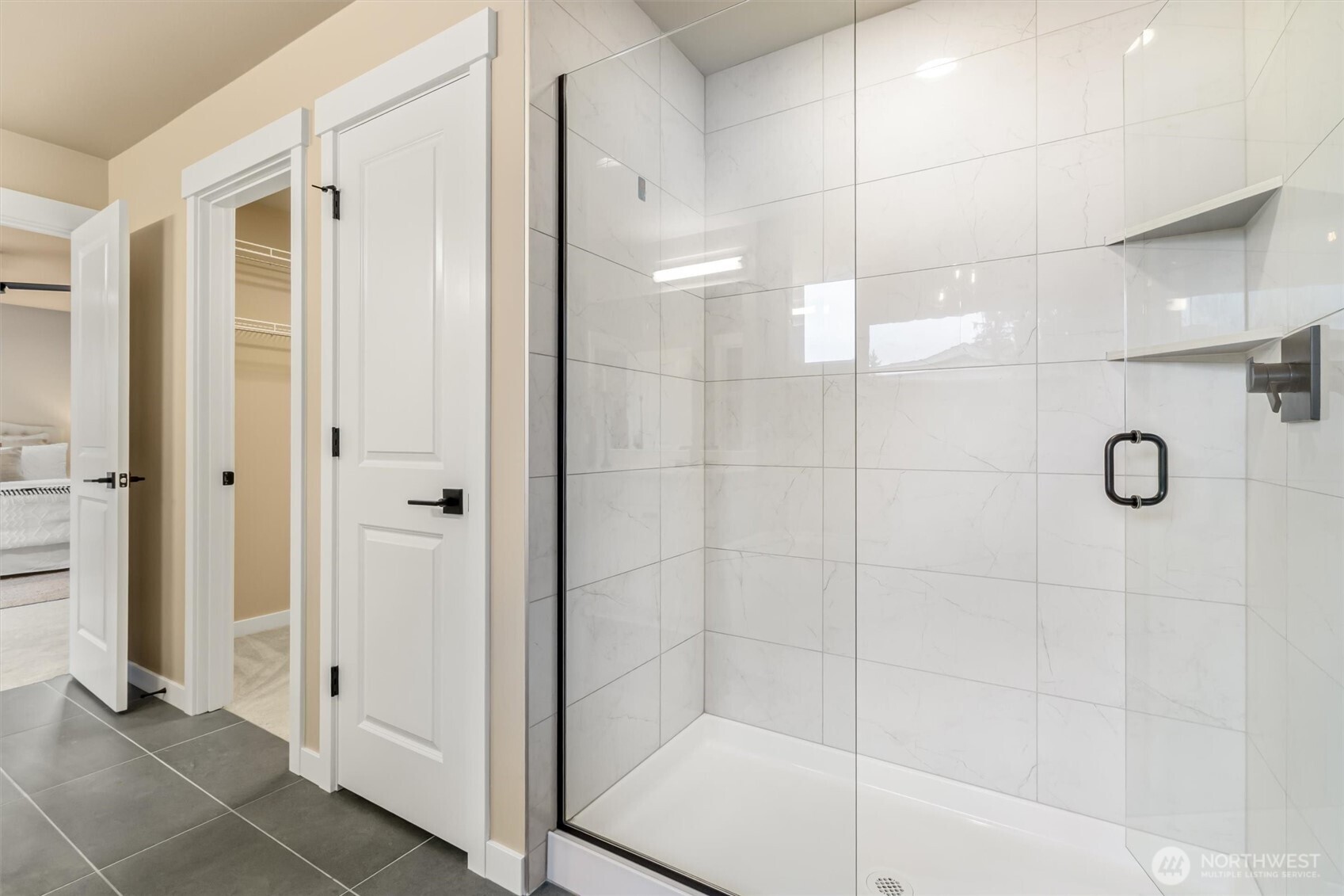 21707 2nd Avenue Southeast Bothell, WA 98021 - Photo 23 of 37 a bathroom with a glass shower door