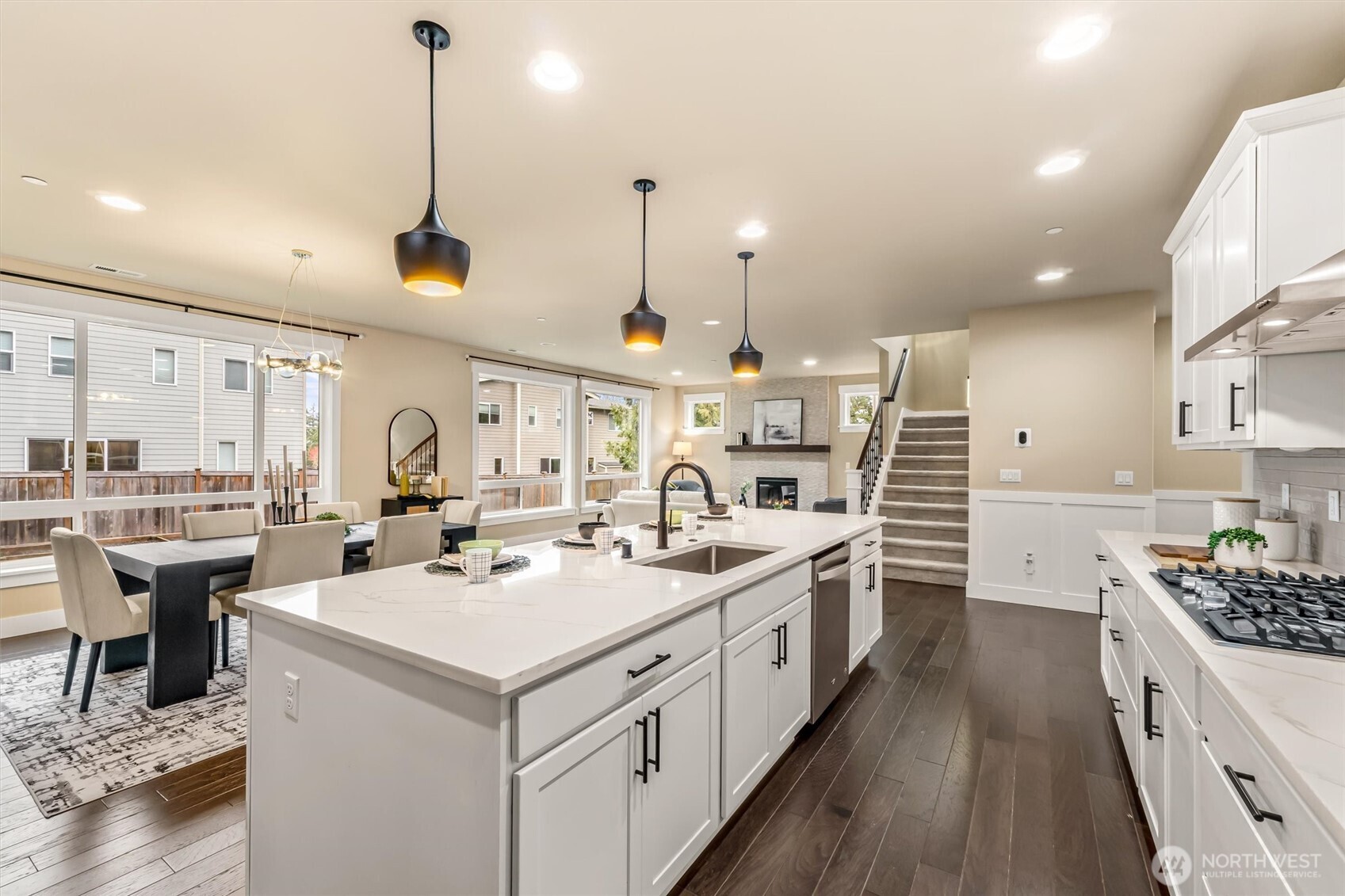 21707 2nd Avenue Southeast Bothell, WA 98021 - Photo 10 of 37 a kitchen with a stove a sink a refrigerator and chairs