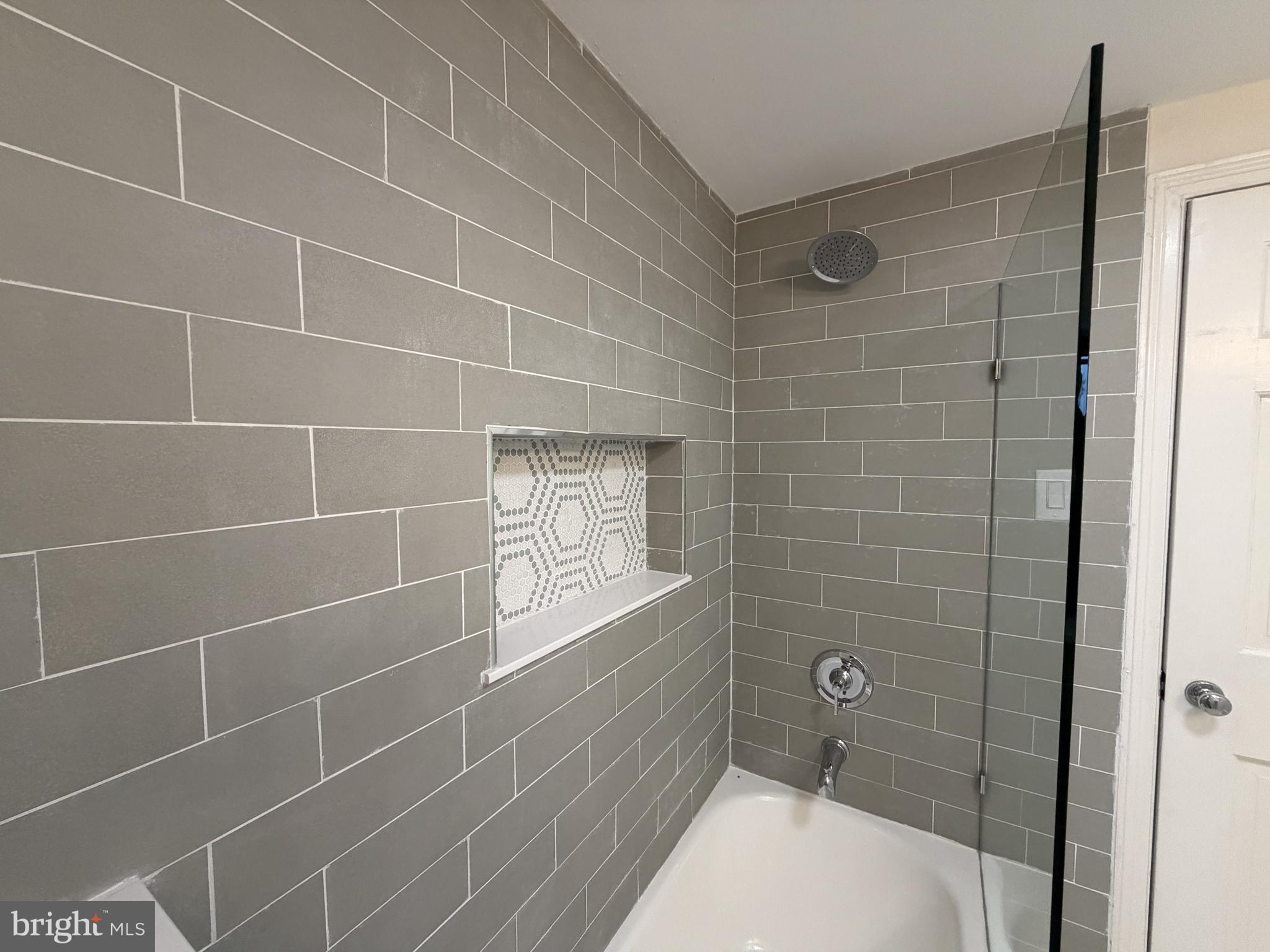 4700 Thompsons Bridge Road Wilmington, DE 19803 - Photo 36 of 41 a bathroom with a bathtub and shower