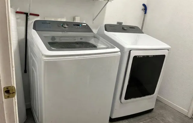 a utility room with dryer and washer