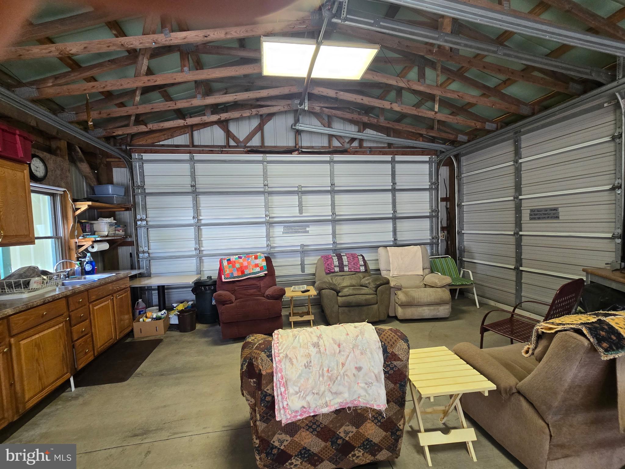 700 Paul Stahl Road Mount Storm, WV 26739 - Photo 10 of 31 Spacious garage with rustic charm.