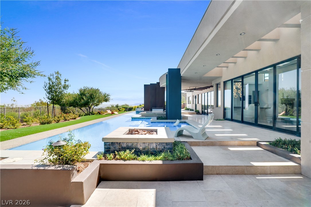10 Ridge Blossom Road Las Vegas, NV 89135 - Photo 50 of 64 View of pool with an outdoor fire pit and a patio