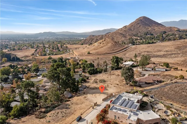 a view of a dry yard with mountains