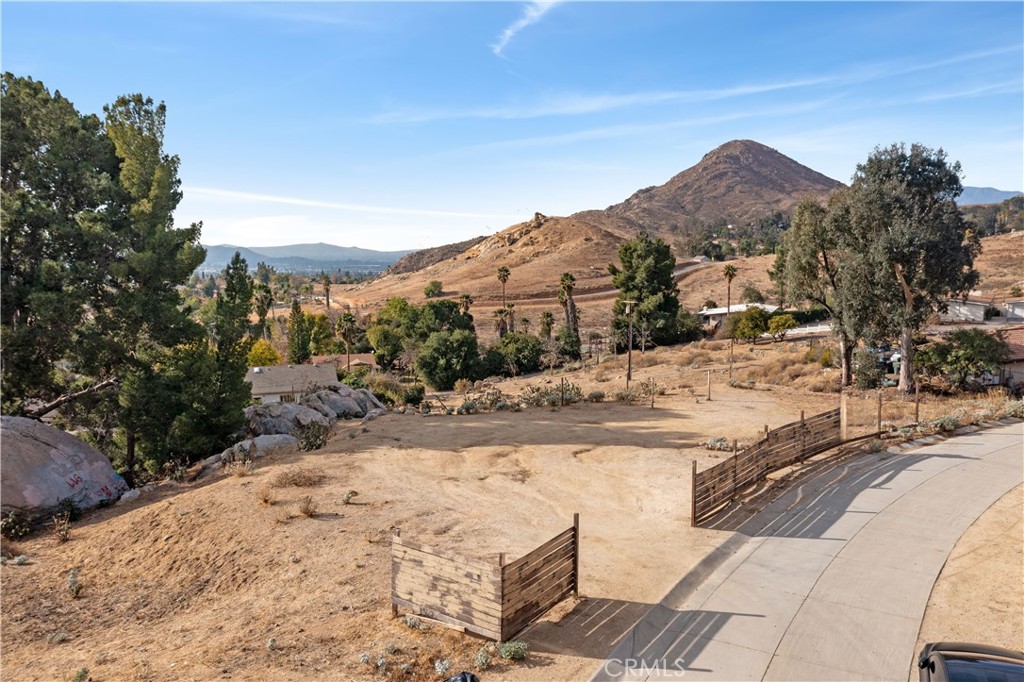 2935 Galaxie Heights Road Riverside, CA 92507 - Photo 29 of 35 a view of a dry yard with a large tree