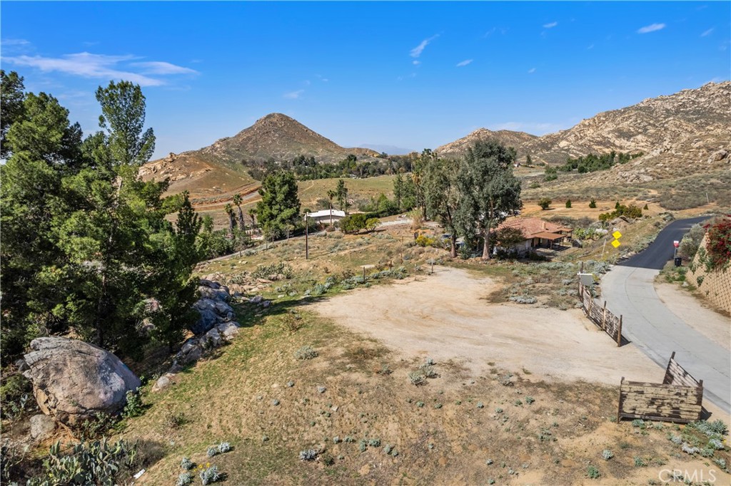 2935 Galaxie Heights Road Riverside, CA 92507 - Photo 4 of 35 a view of a dry yard with trees