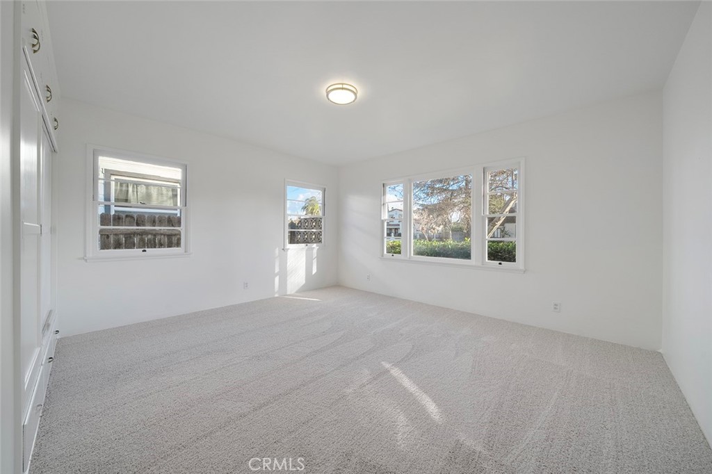 4693 Central Riverside, CA 92506 - Photo 19 of 31 an empty room with windows and fireplace