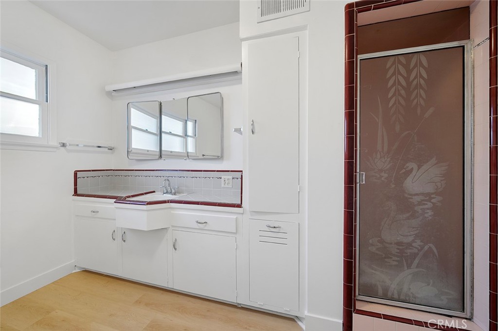 4693 Central Riverside, CA 92506 - Photo 21 of 31 a bathroom with a sink and a mirror