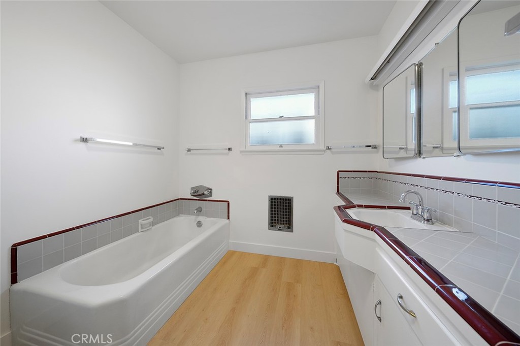 4693 Central Riverside, CA 92506 - Photo 22 of 31 a bathroom with a tub sink and mirror