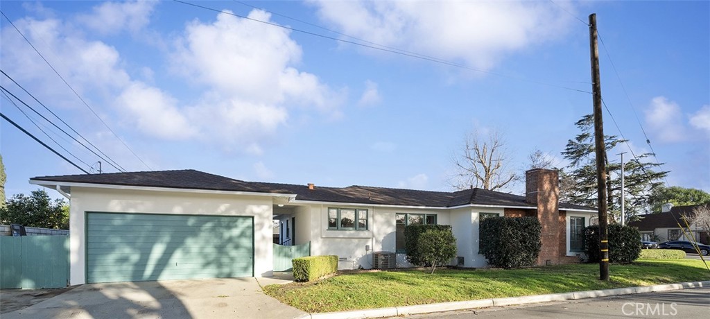 4693 Central Riverside, CA 92506 - Photo 4 of 31 a front view of a house with a yard