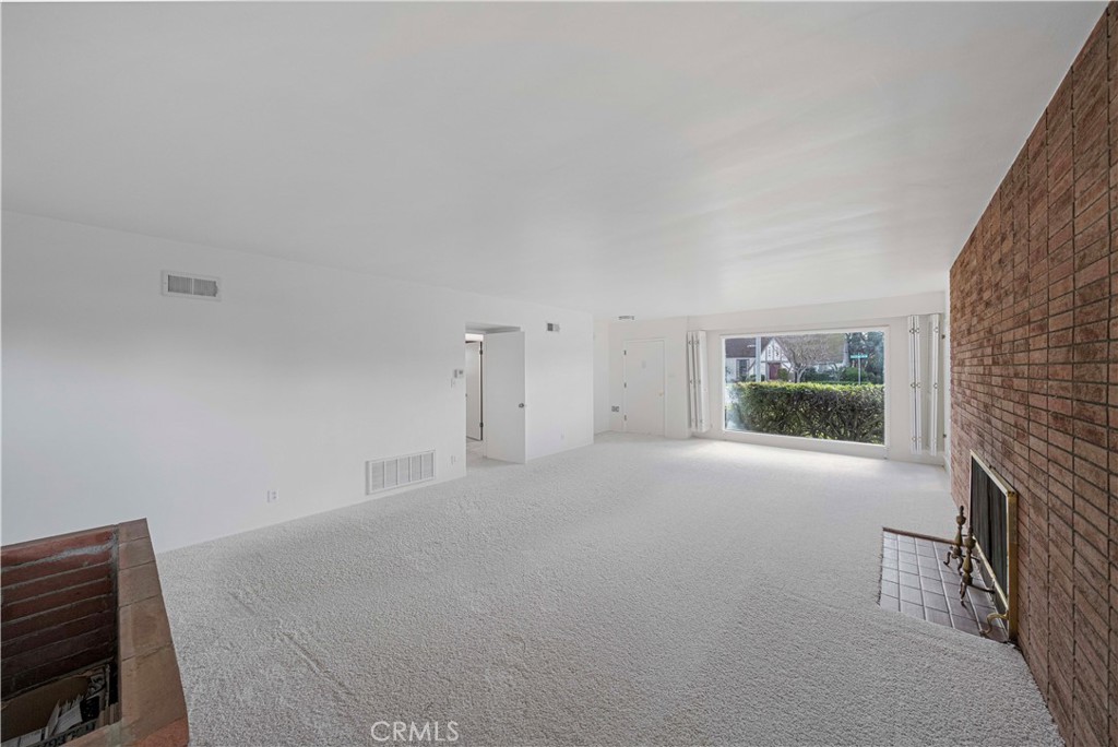 4693 Central Riverside, CA 92506 - Photo 7 of 31 a view of empty room with window and fireplace