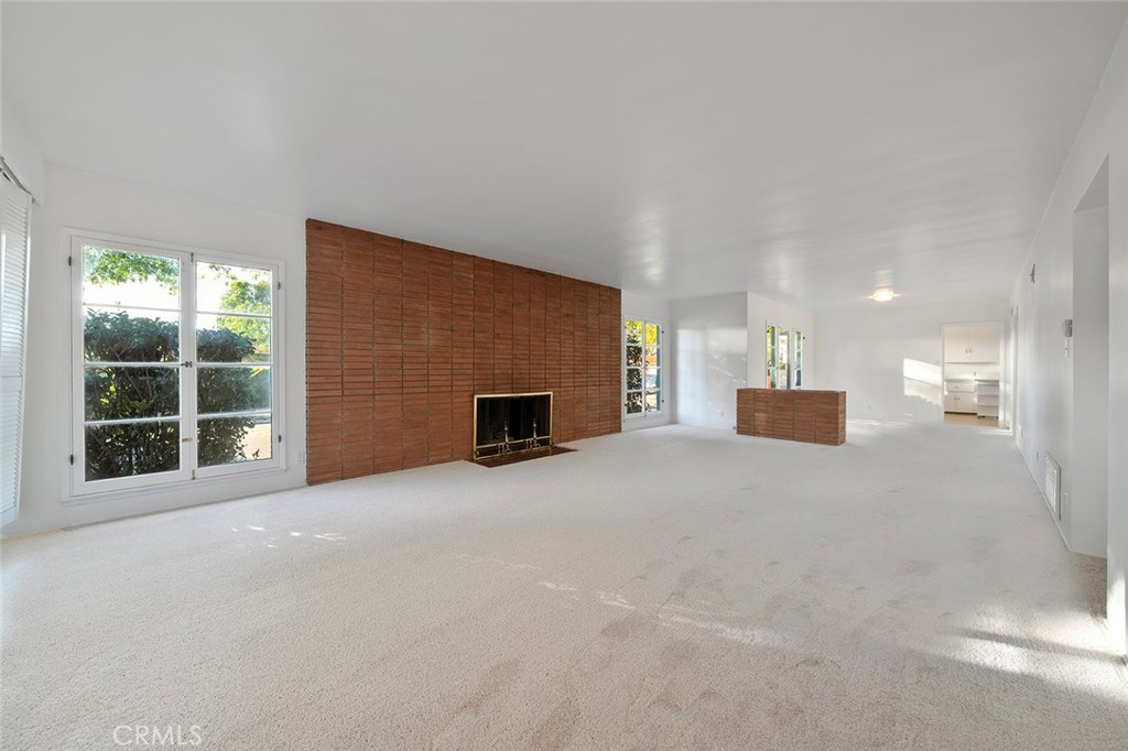 4693 Central Riverside, CA 92506 - Photo 8 of 31 a view of an empty room with a fireplace and a window