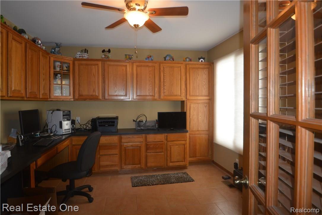 706 Snowmass Drive Rochester, MI 48309 - Photo 13 of 25 Custom built office with french door, ceramic flooring, located in the center part of the house, great for people working from home.