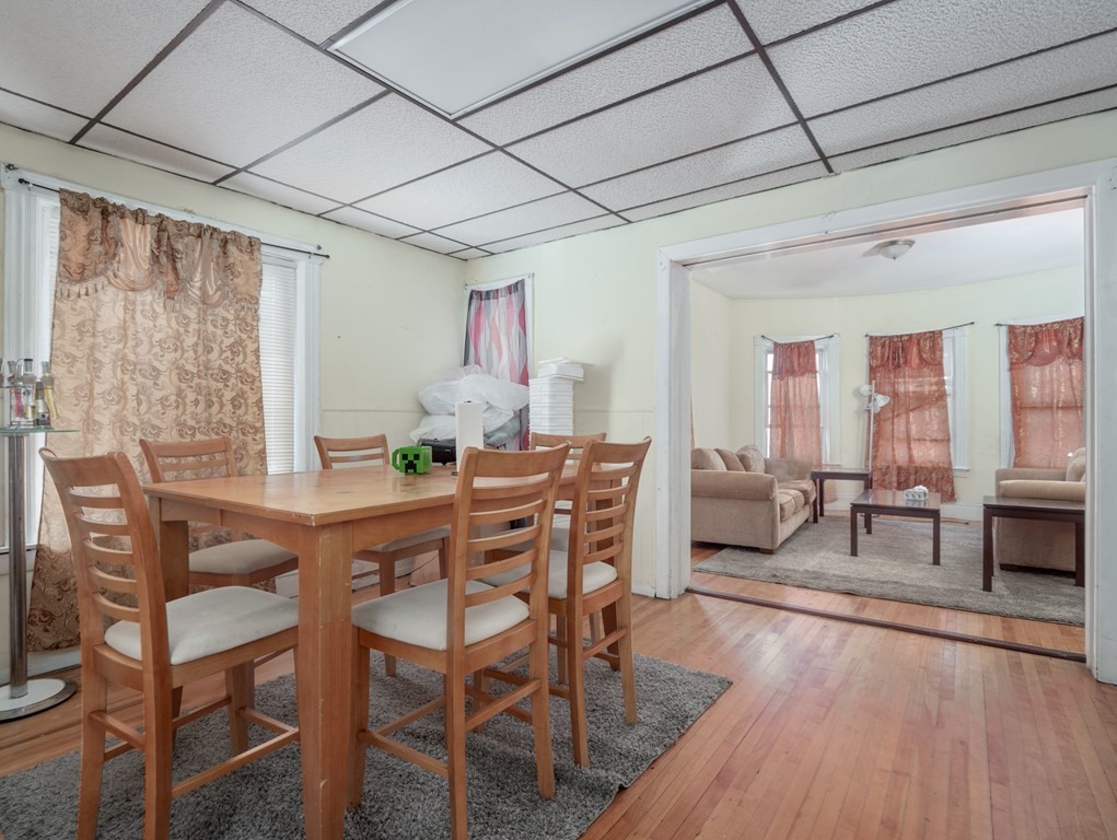 83 Canterbury Street Worcester, MA 01603 - Photo 11 of 42 a dining room with furniture window and wooden floor