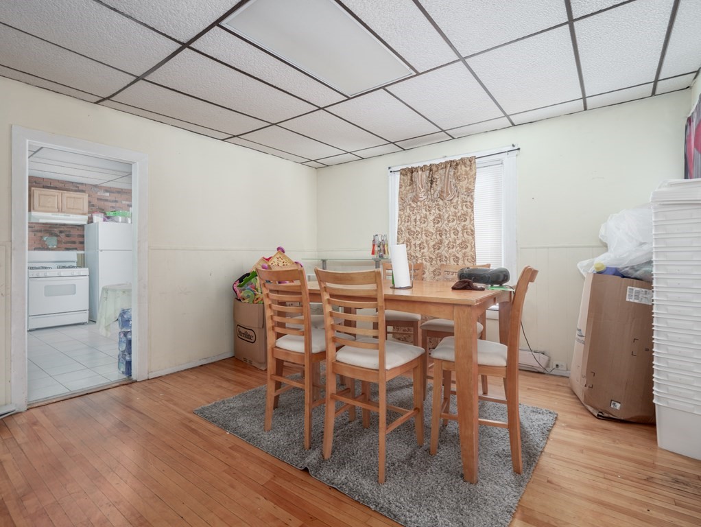 83 Canterbury Street Worcester, MA 01603 - Photo 12 of 42 a view of a dining room with furniture and wooden floor