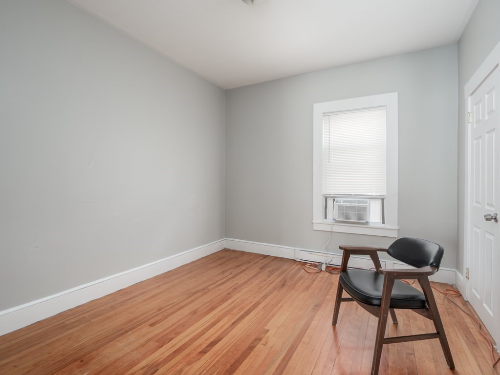 83 Canterbury Street Worcester, MA 01603 - Photo 16 of 42 a view of a livingroom with furniture and wooden floor