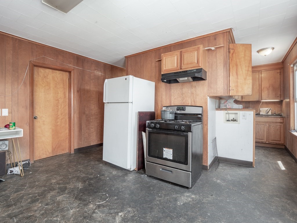 83 Canterbury Street Worcester, MA 01603 - Photo 22 of 42 a kitchen with stainless steel appliances a stove a refrigerator and a sink