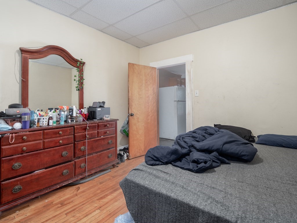 83 Canterbury Street Worcester, MA 01603 - Photo 24 of 42 a bed room with a bed and a dresser