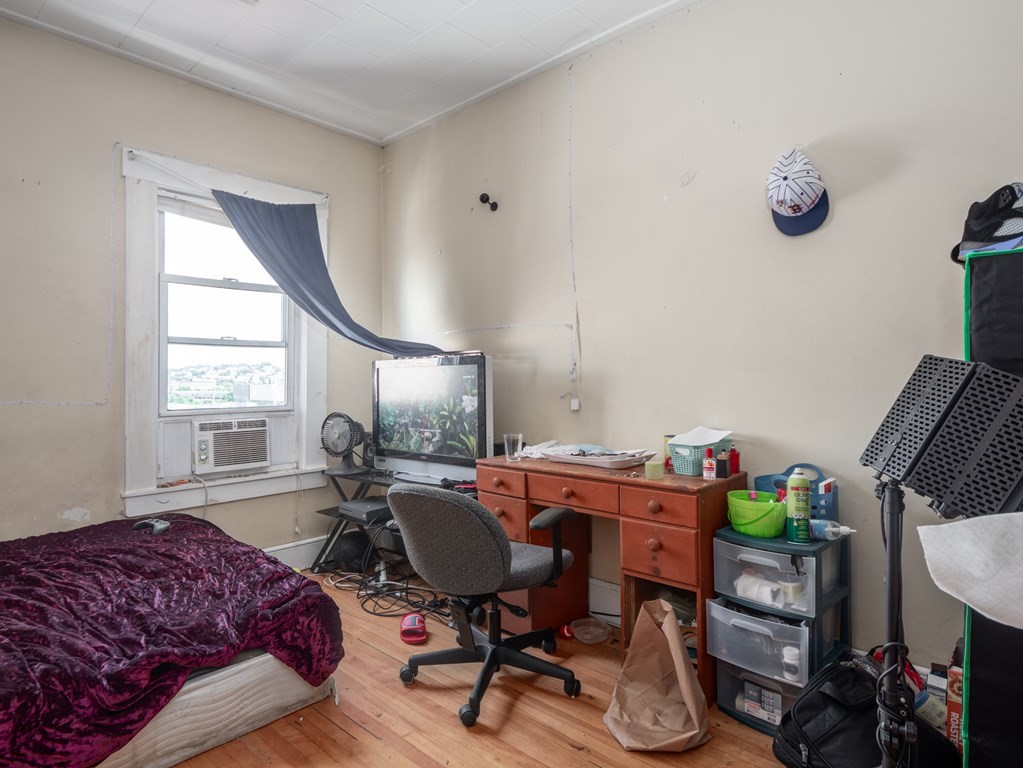 83 Canterbury Street Worcester, MA 01603 - Photo 25 of 42 a workspace with furniture and a window