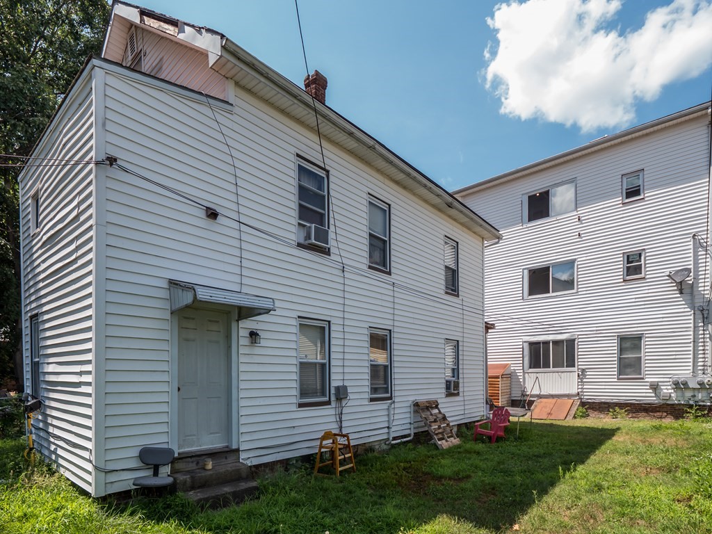 83 Canterbury Street Worcester, MA 01603 - Photo 30 of 42 a view of a house with a yard