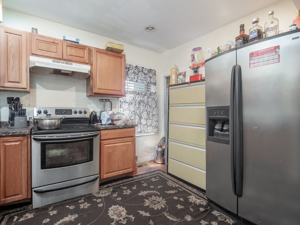 83 Canterbury Street Worcester, MA 01603 - Photo 35 of 42 a kitchen with stainless steel appliances a refrigerator sink and stove