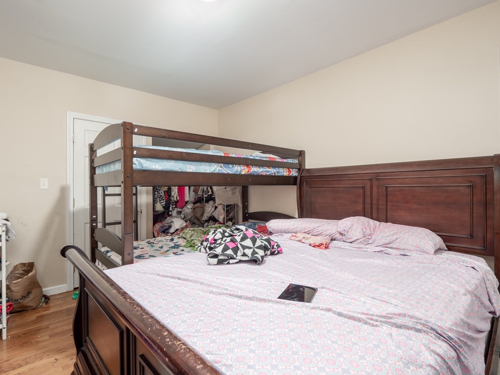83 Canterbury Street Worcester, MA 01603 - Photo 38 of 42 a bedroom with a bed and a table