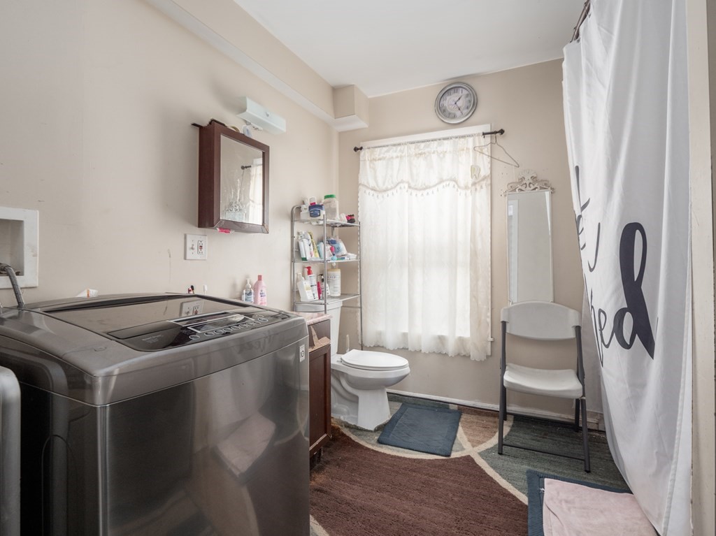 83 Canterbury Street Worcester, MA 01603 - Photo 40 of 42 a bathroom with a sink toilet and shower