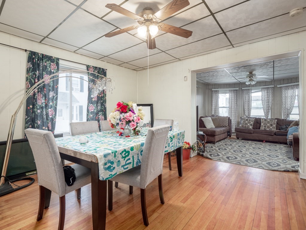 83 Canterbury Street Worcester, MA 01603 - Photo 4 of 42 a view of a dining room with furniture window and wooden floor
