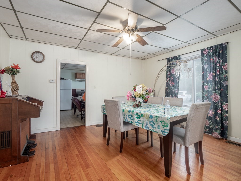 83 Canterbury Street Worcester, MA 01603 - Photo 5 of 42 a view of a dining room with furniture and wooden floor