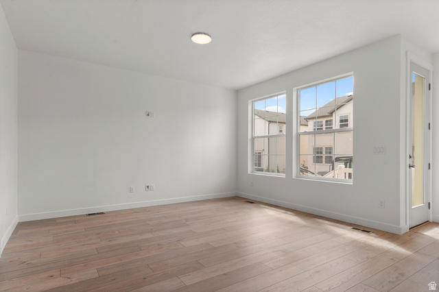 7797 West Alta Springs Way Magna, UT 84044 - Photo 8 of 21 Spare room with light wood finished floors