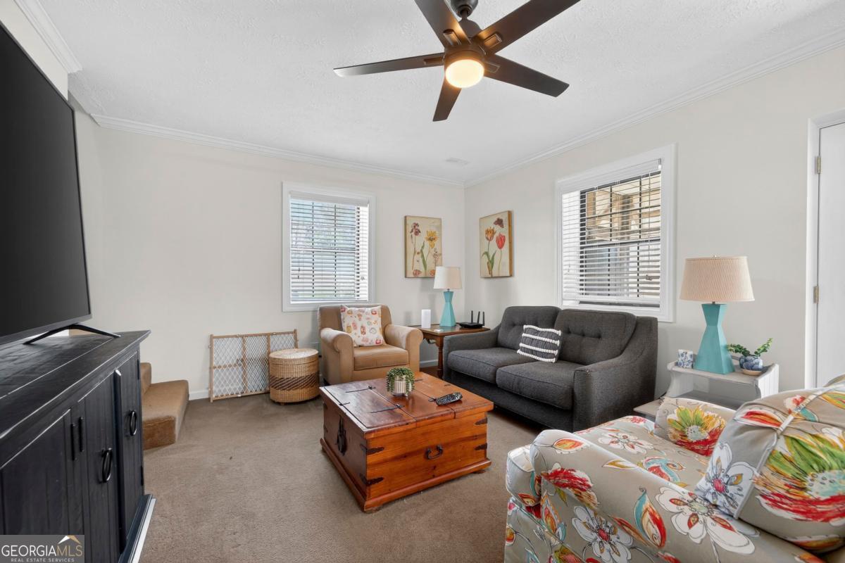 219 Hickory Pass Sparta, GA 31087 - Photo 14 of 62 a bedroom with two beds and a window
