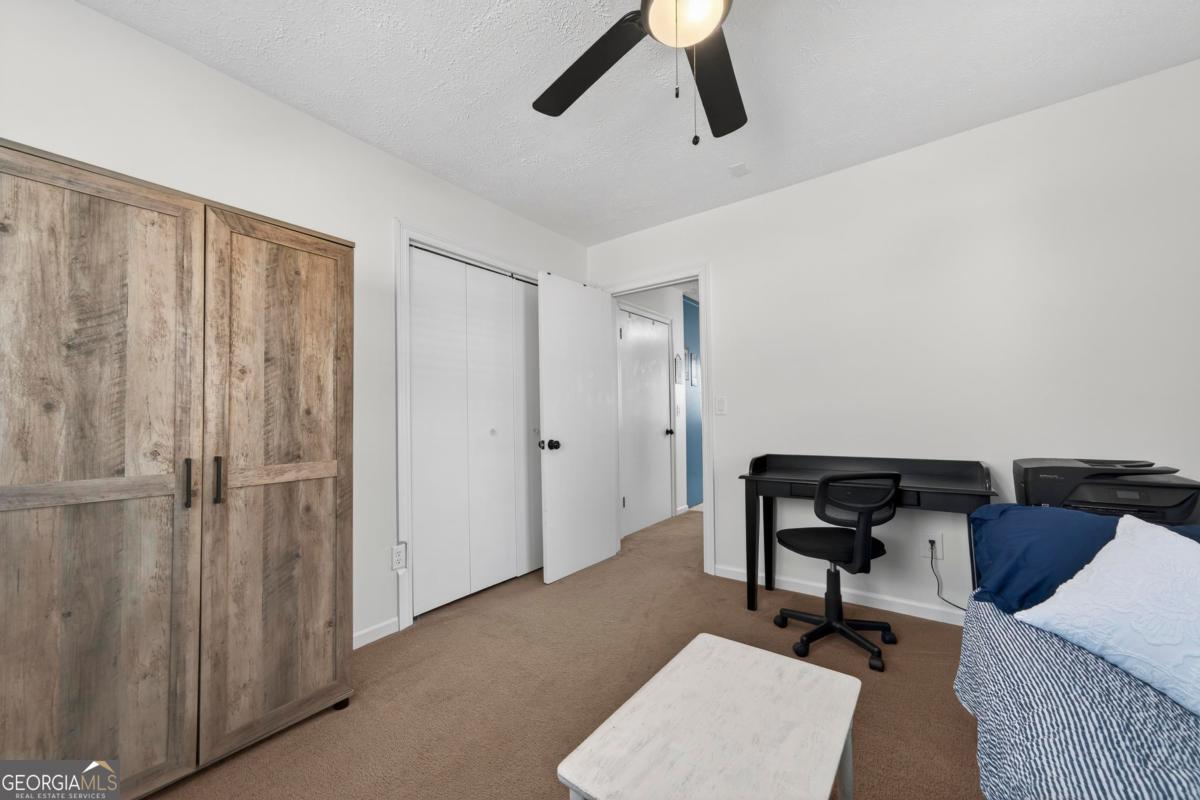 219 Hickory Pass Sparta, GA 31087 - Photo 17 of 62 a view of a livingroom with workspace and a couch