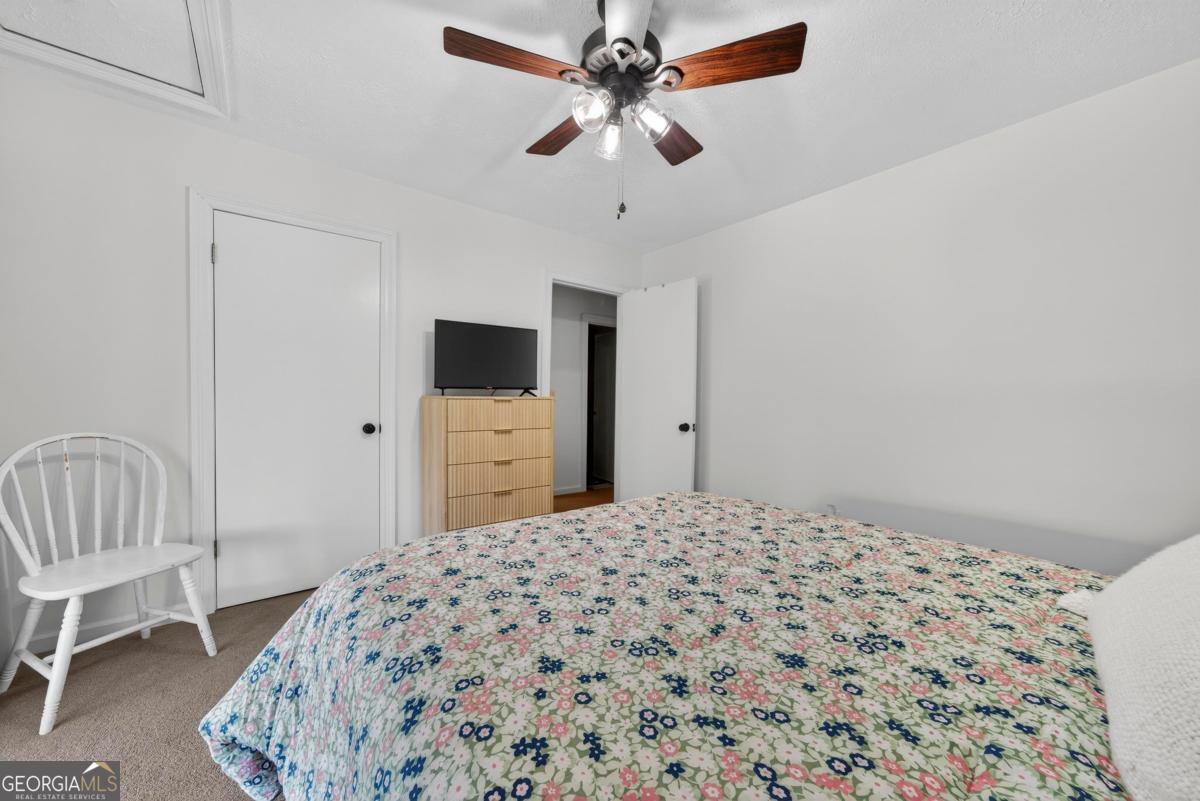 219 Hickory Pass Sparta, GA 31087 - Photo 29 of 62 a bedroom with a bed and a dresser